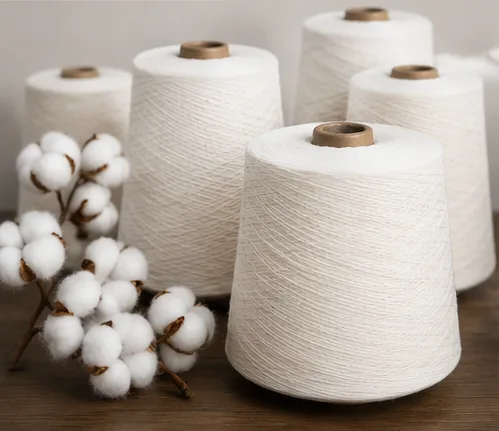 Natural white cotton yarn cones with cotton bolls
